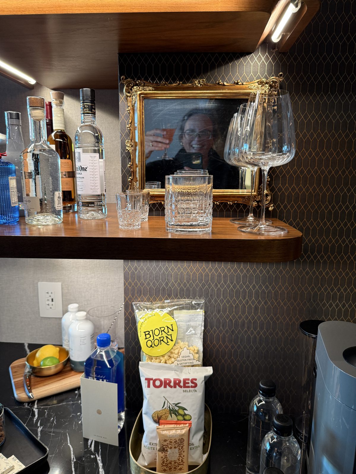 In-room bar at The Global Ambassador stocked with gluten free Bjorn Qorn popcorn and Torres olive oil chips