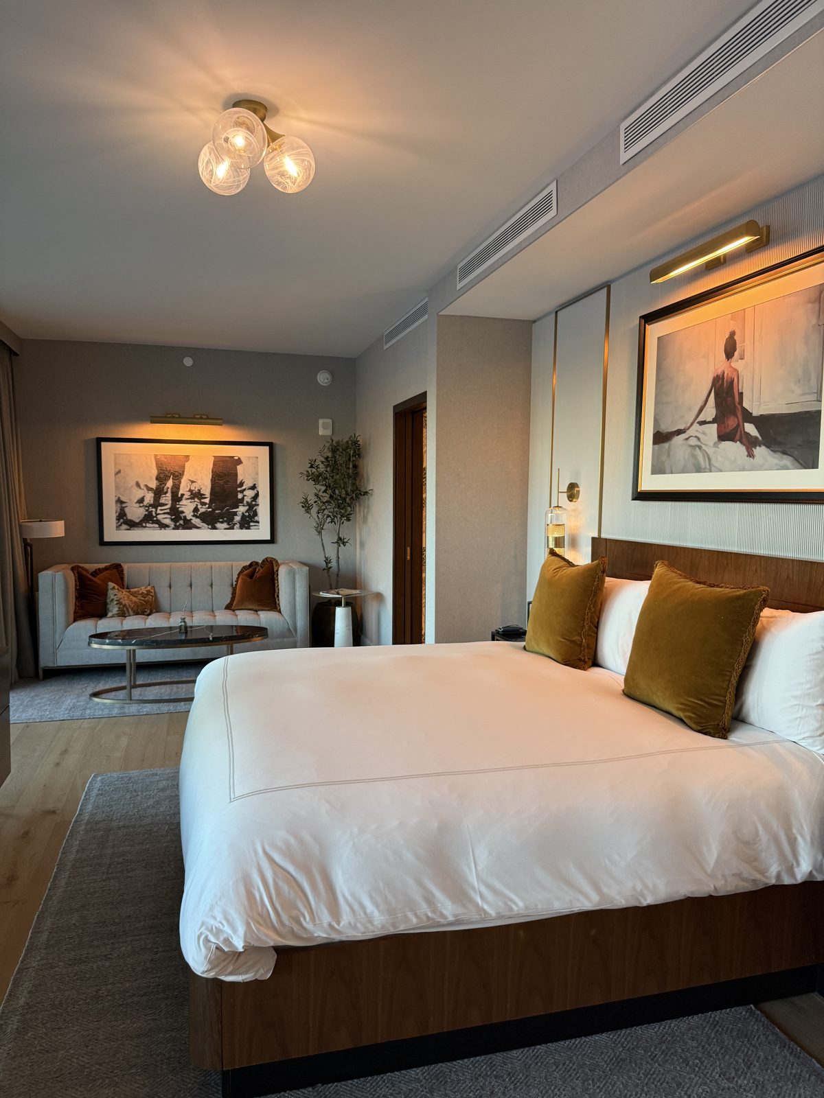 King bed and sitting area in an 800 square foot Terrace Suite at The Global Ambassador in Phoenix