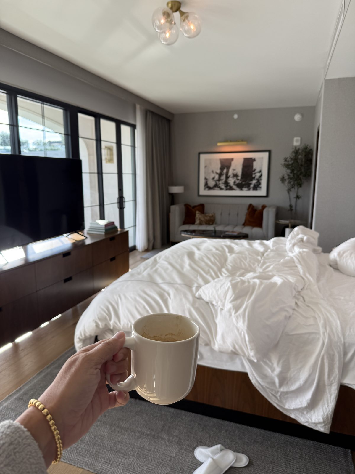 Morning coffee in a Terrace Suite at The Global Ambassador, looking toward the bed and the terrace doors