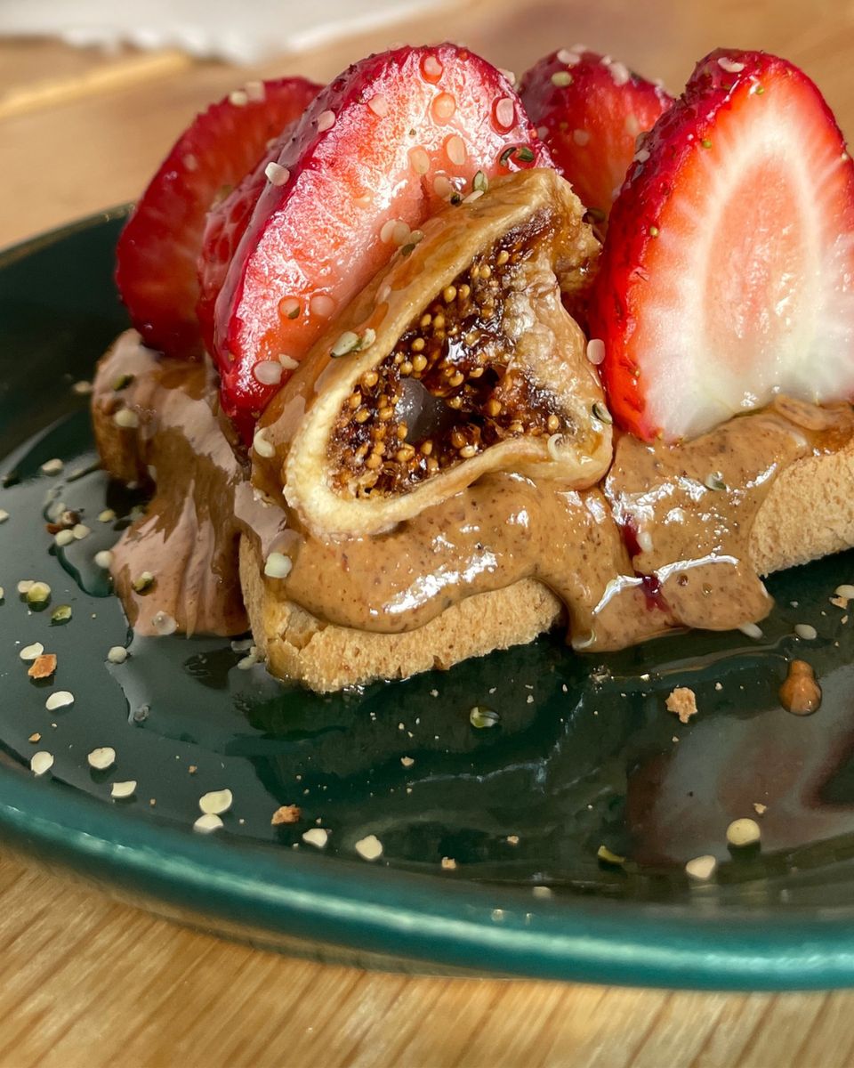 Gluten free oat bread topped with almond butter, fresh figs and sliced strawberries at Plant in Oklahoma City.